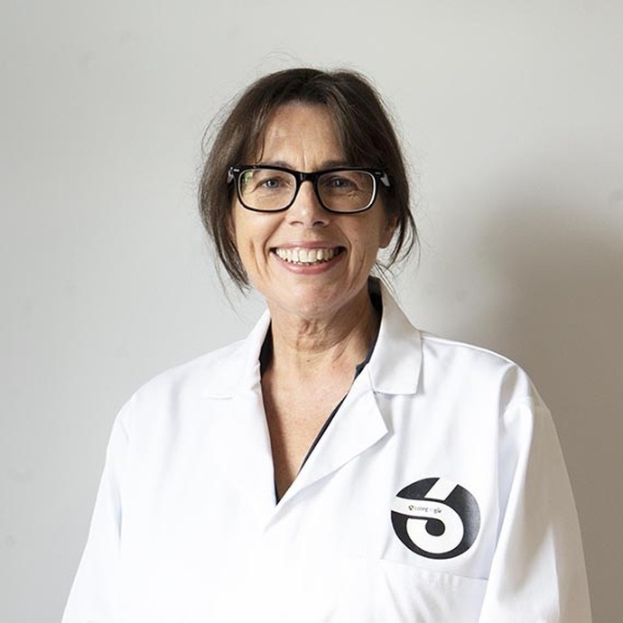 Susan Ford in a white lab coat with the Sir Gar 6 logo on it