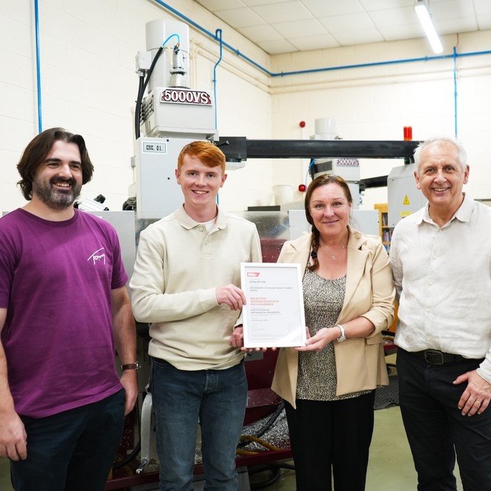 Karen, head of engineering with lecturer Chris and two engineering degree students