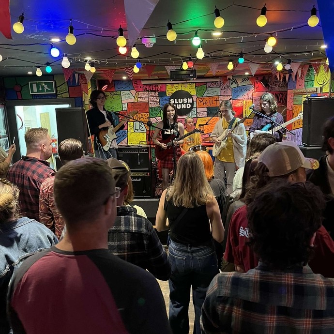 Katalogen band performing on stage in front of crowd