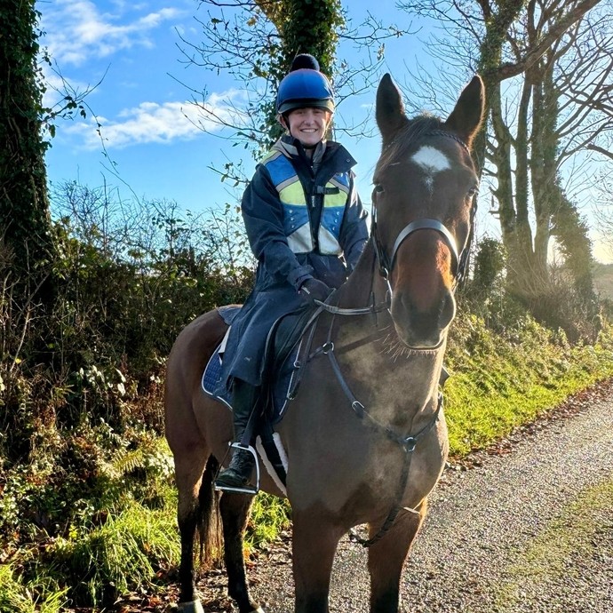 Neide on her brown horse