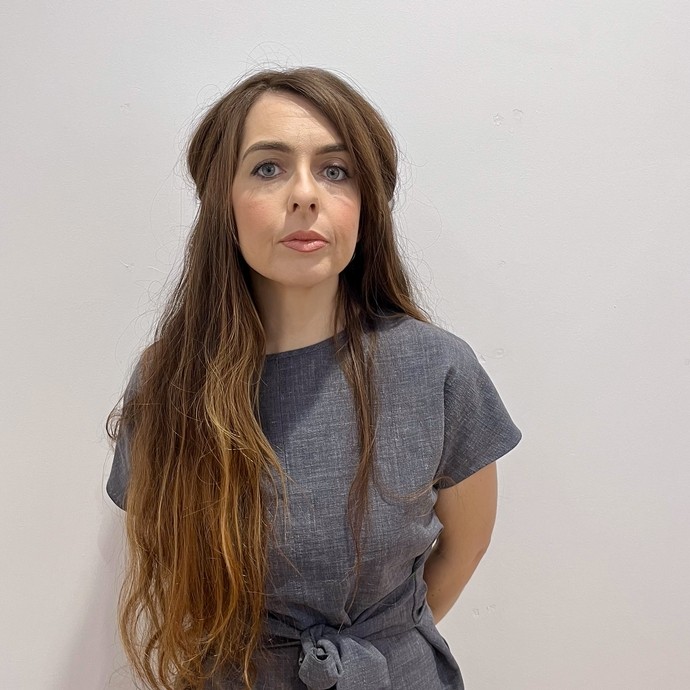 Nia in her grey beauty college uniform