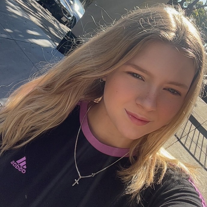 A selfie of Amber wearing a black t-shirt and she has long fair hair