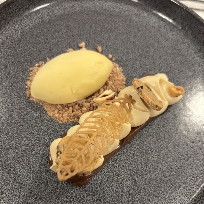 A very ornate piece of fine dining desert