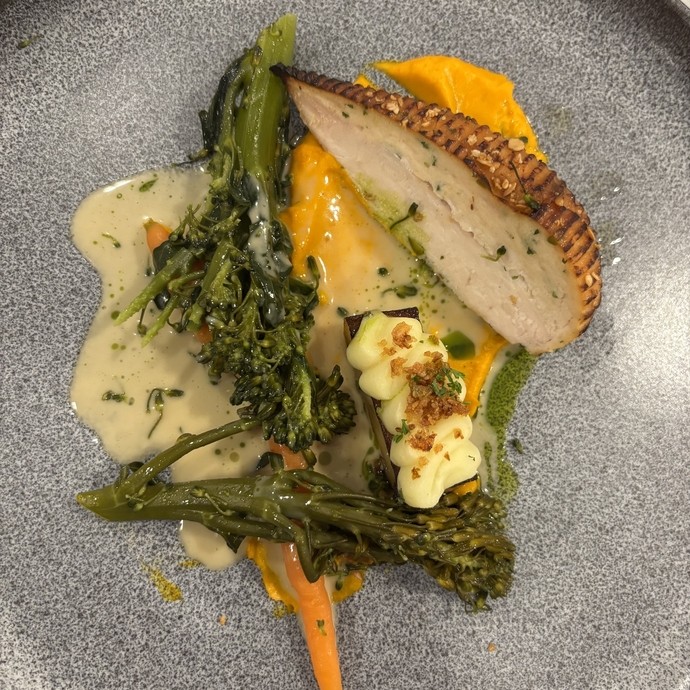 Some meat with vegetables and a sauce 