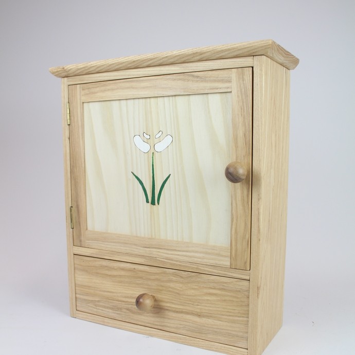 A tool box she made for her jewellery tools with a flower motif on the front