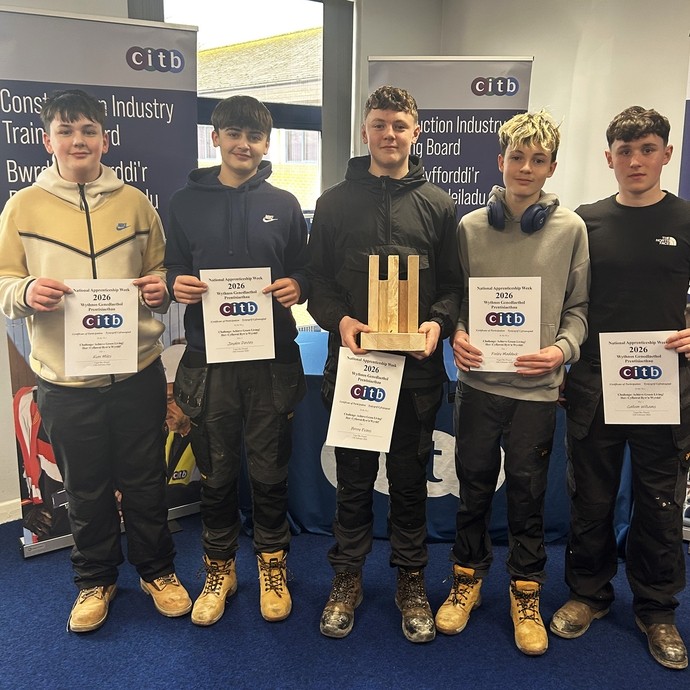 Five students in a line holding their CITB certificates